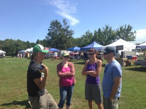 people at farm event talking